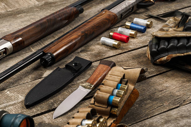 istock Various hunting equipment on old wooden background 1320902375