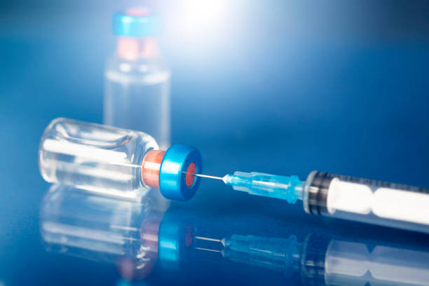 istock Covid-19 vaccination with vaccine bottle and syringe injection tool for coronavirus immunization treatment. 1320905756