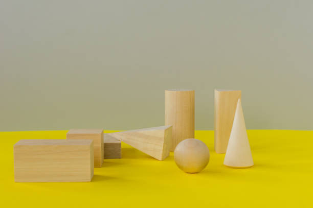 istock wooden geometric shapes on a yellow background. preschool learning 1320908251