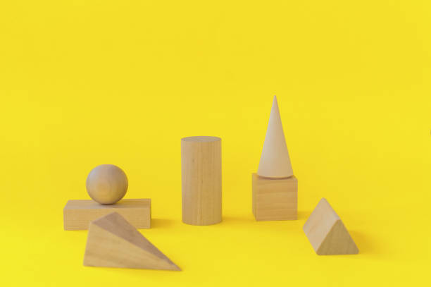istock wooden geometric shapes on a yellow background. preschool learning 1320908253