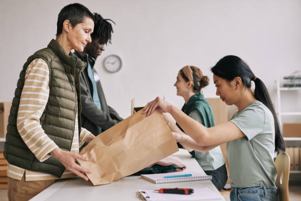 istock Woman Donating Clothes 1320910653