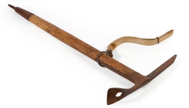 istock Vintage wooden handled ice axe on a white background 1320910800