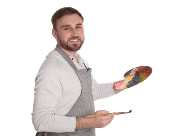 istock Man with painting tools on white background. Young artist 1320910833