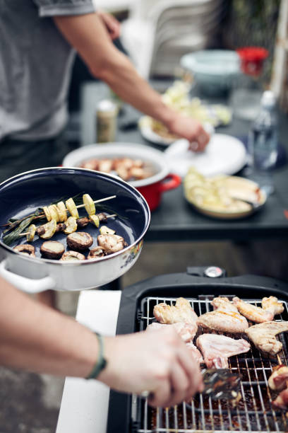 istock Preparing barbeque on a electrical modern grill outdoors. 1320911756
