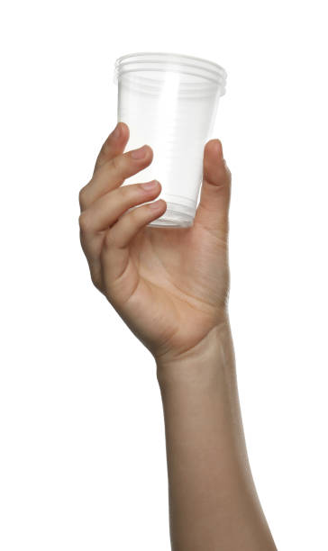 istock Woman holding plastic cups on white background, closeup 1320911783