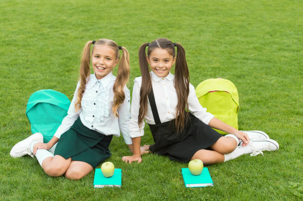 istock School friends relaxing after classes at school yard, soulmates concept 1320912281