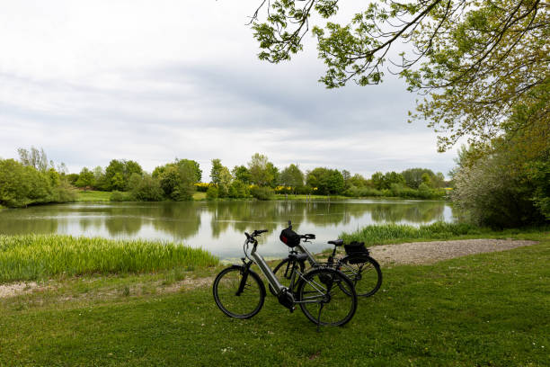 istock Bicycles stand on the shore of a small lake 1320914105