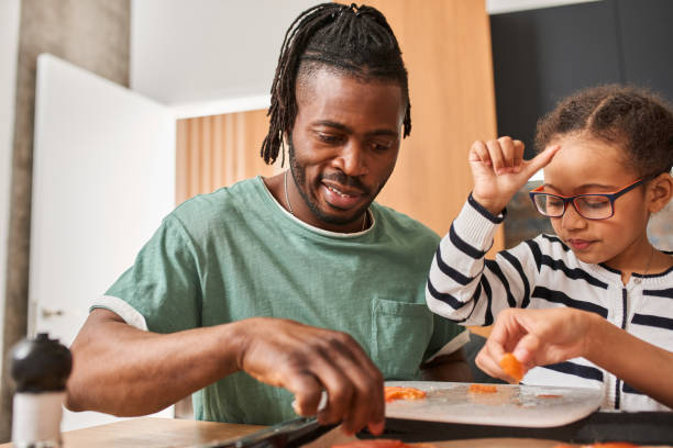 istock Father enjoying weekend and cooking with his childrens 1320914737