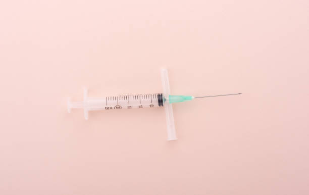 istock Plastic medical syringe 25 ml on the cap from the needle. 1320914750