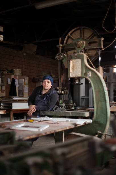 istock Young adult carpenter in his work shop 1320914765