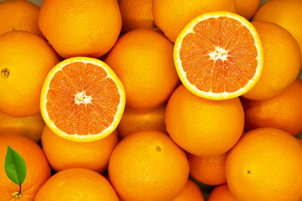 istock Top view of harvested fresh, ripe, round oranges. 1320915192