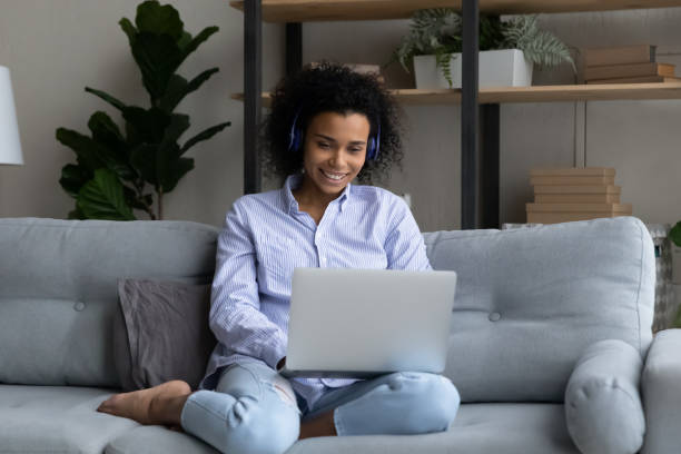 istock Happy African American woman talk on video call on computer 1320918175