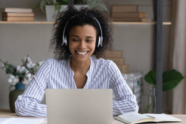istock Smiling biracial female student talk on video call 1320918242