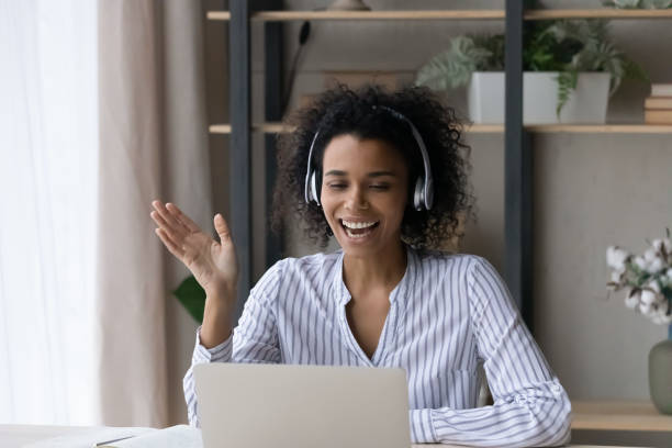 istock Smiling biracial woman have webcam call on computer 1320918253