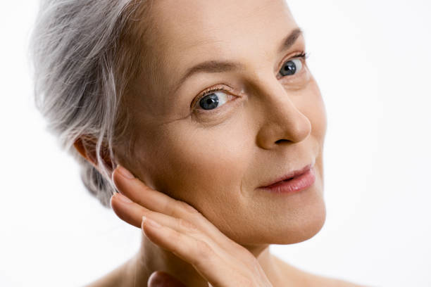 istock Mature woman looking at the camera isolated on white 1320918753