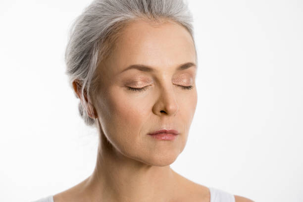 istock Lady standing opposite with closed eyes in front of the camera in studio 1320918760