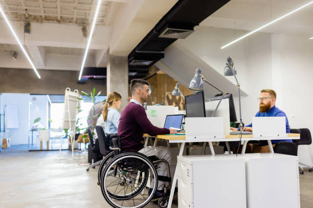 istock Group of architects  working late  in co-working space 1320919895