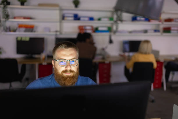 istock Cybersecurity expert working late on protecting company 1320919896