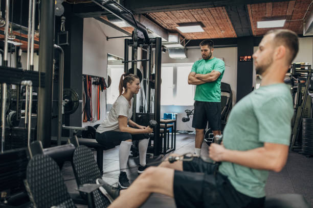 istock Two people exercising with fitness trainer 1320920106