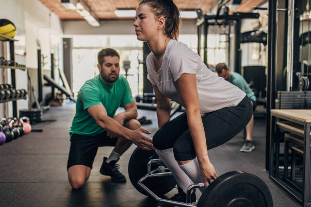istock People exercising with fitness trainer 1320920927