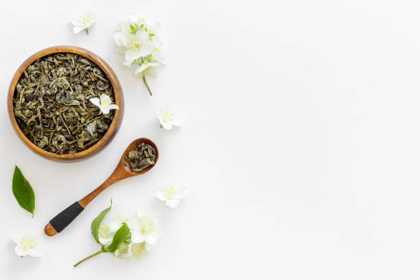 istock Jasmine flowers with dry tea in bowl. Top view 1320921469