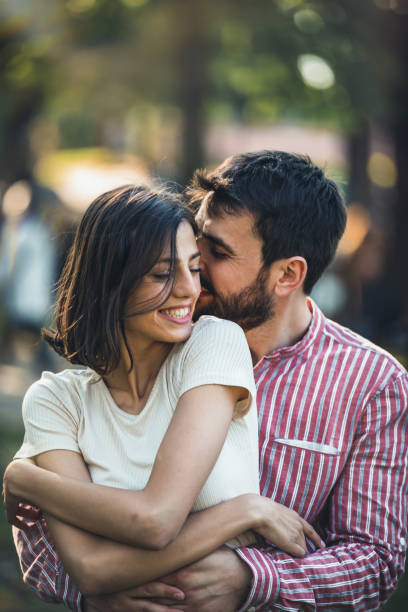 istock Young couple having fun in park. 1320921562