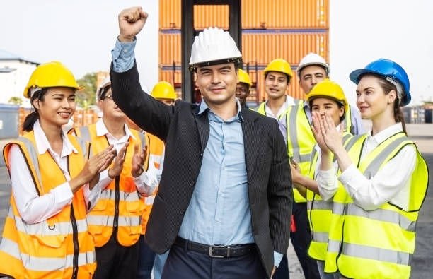 istock Professional Engineering and worker team congratulated success by applaud their leader after construction project complete and he Raise your hand happily 1320922738