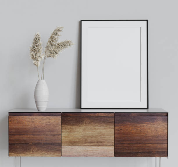 istock Mock up poster frame on wooden cabinet in simple home interior. 3d render. 1320922848