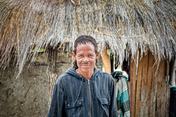 istock Smiling African man portrait standing in his yard 1320923093