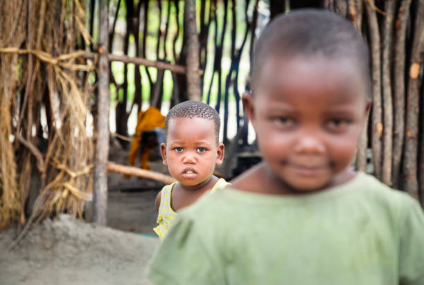 istock Small African toddler siblings standing in their yard 1320923129