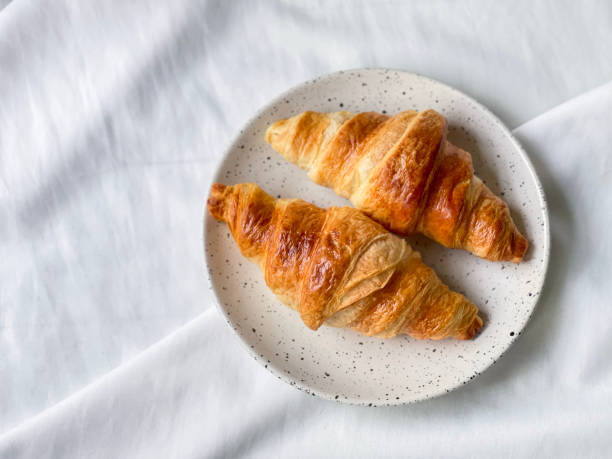 istock Freshly baked plain butter croissant. (top view) 1320924283