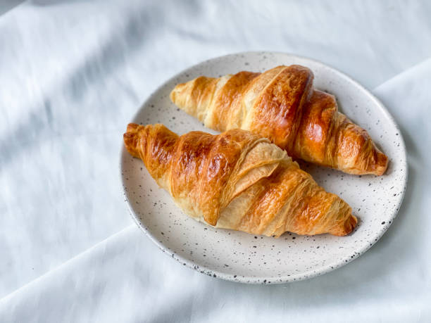 istock Freshly baked plain butter croissant. (close up) 1320924291