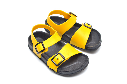 Black and yellow children's sandals made of rubber