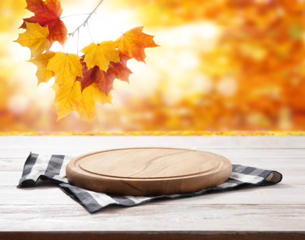 istock Empty vintage pizza board and napkin on planks. 1320929037