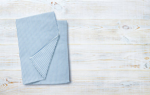 istock Napkin, table cloth on wooden deck mockup. 1320929068