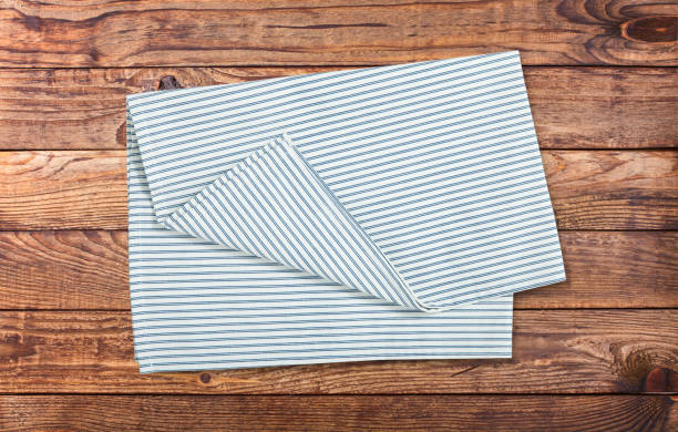 istock Napkin, table cloth on wooden deck mockup. 1320929076