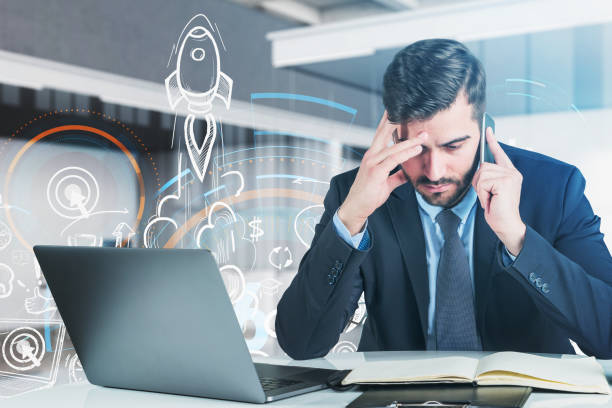 istock Front view of handsome businessman pondering about start up proj 1320931539
