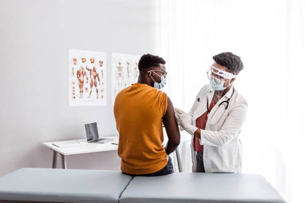 istock Doctor applying vaccine on patient's arm 1320931848