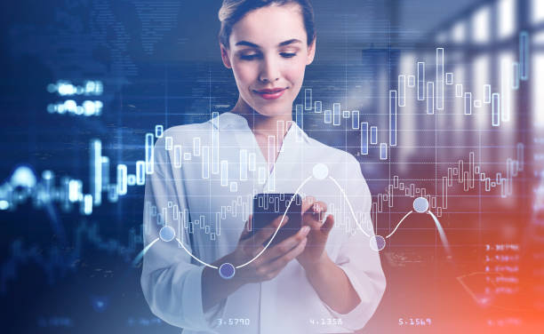 istock Businesswoman with phone in hands, graph chart with candlesticks 1320931969