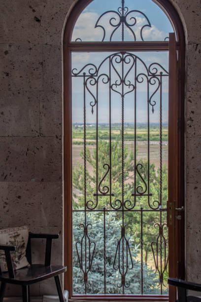 istock Nice view from the balcony. Chair and window with bars 1320933799