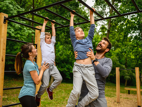 Family doing exercises outdoors