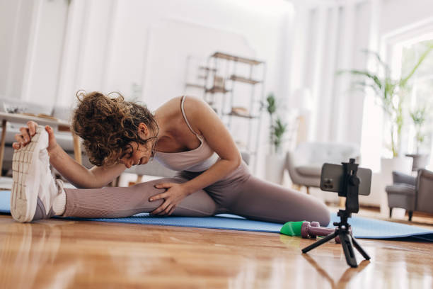 istock Fitness vlogger training at home 1320935333