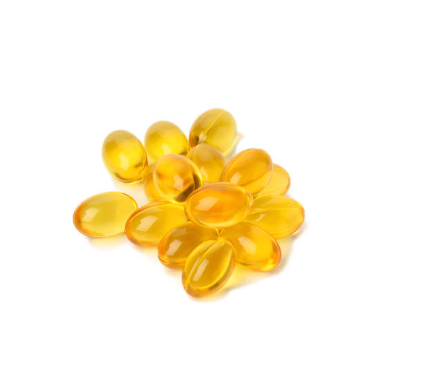 istock scattered oval tablets with fish oil, omega 3 on a white background 1320935726