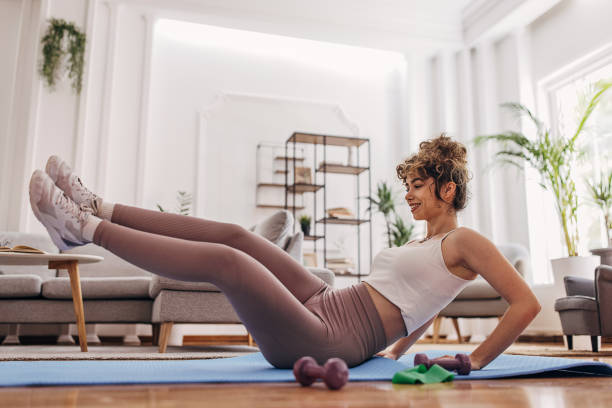 istock Beautiful woman training at home 1320938383