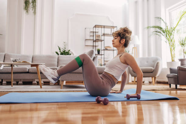istock Beautiful woman training at home 1320938469
