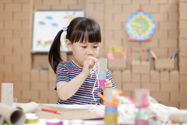 istock Girl Looking At Camera On Table 1320939375