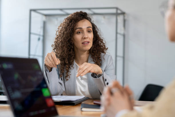 istock Confident businesswoman explaining one of working points 1320939922