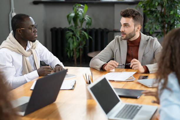 istock Two intercultural businessmen consulting or brainstorming 1320939969