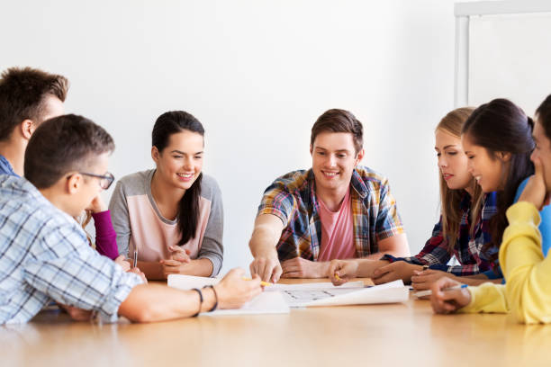 istock group of smiling students meeting at school 1320942224