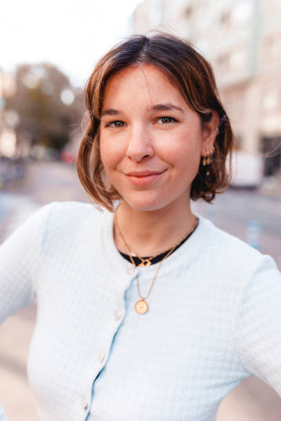 istock Smiling woman on the street 1320942247
